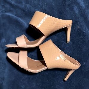 Backless open toed heels.